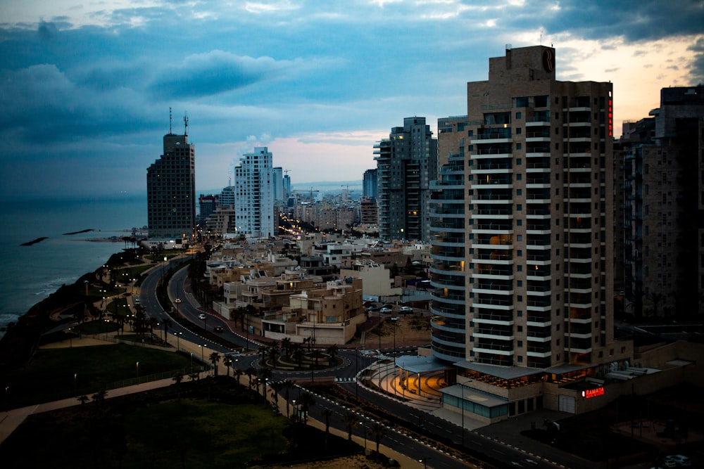 view of high rise buildings and roadways under blue sky