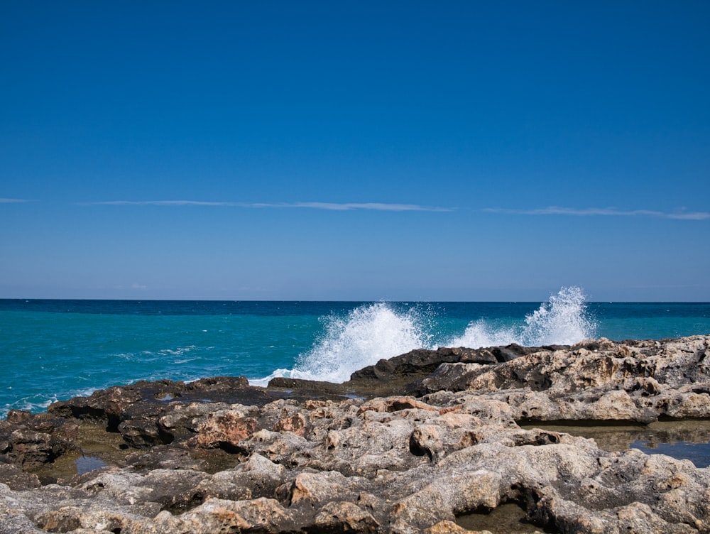 waves splashing on rocks by the seashore