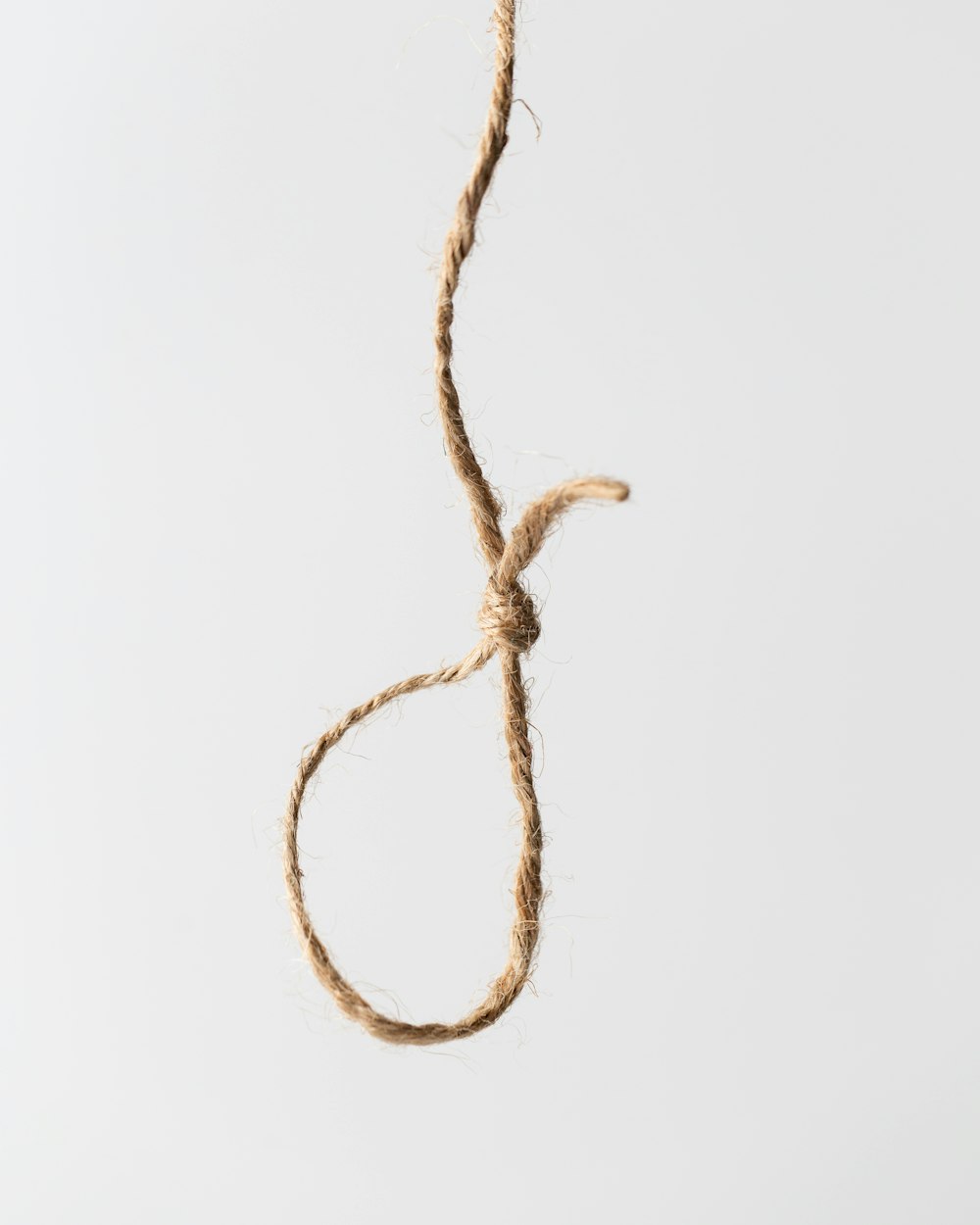 Knot On Brown Rope End Against White Background Stock Photo - Download  Image Now - Rope, Tied Knot, String - iStock