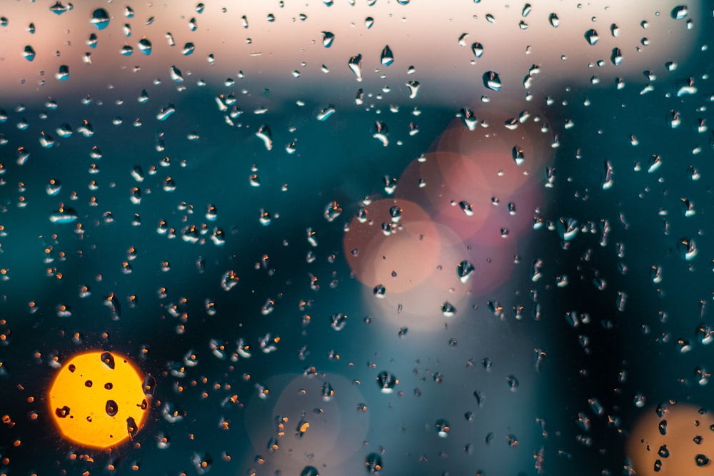 rain drops on a window with a blurry background