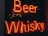 Neon signage displays the words Beer and Whisky in bright red against a dark background.