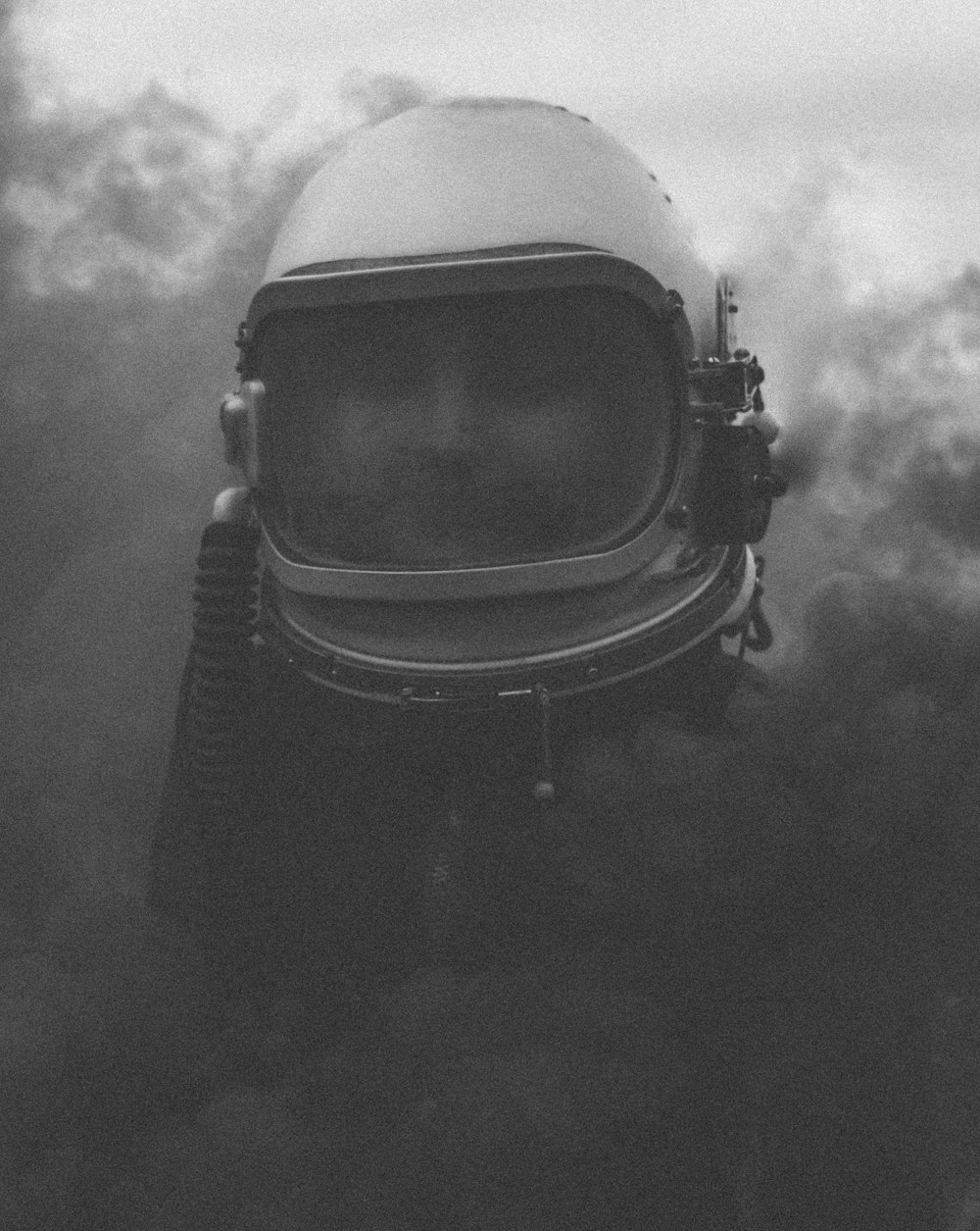 grayscale photo of person wearing vintage scuba helmet