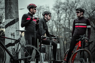 3 men on bikes talking