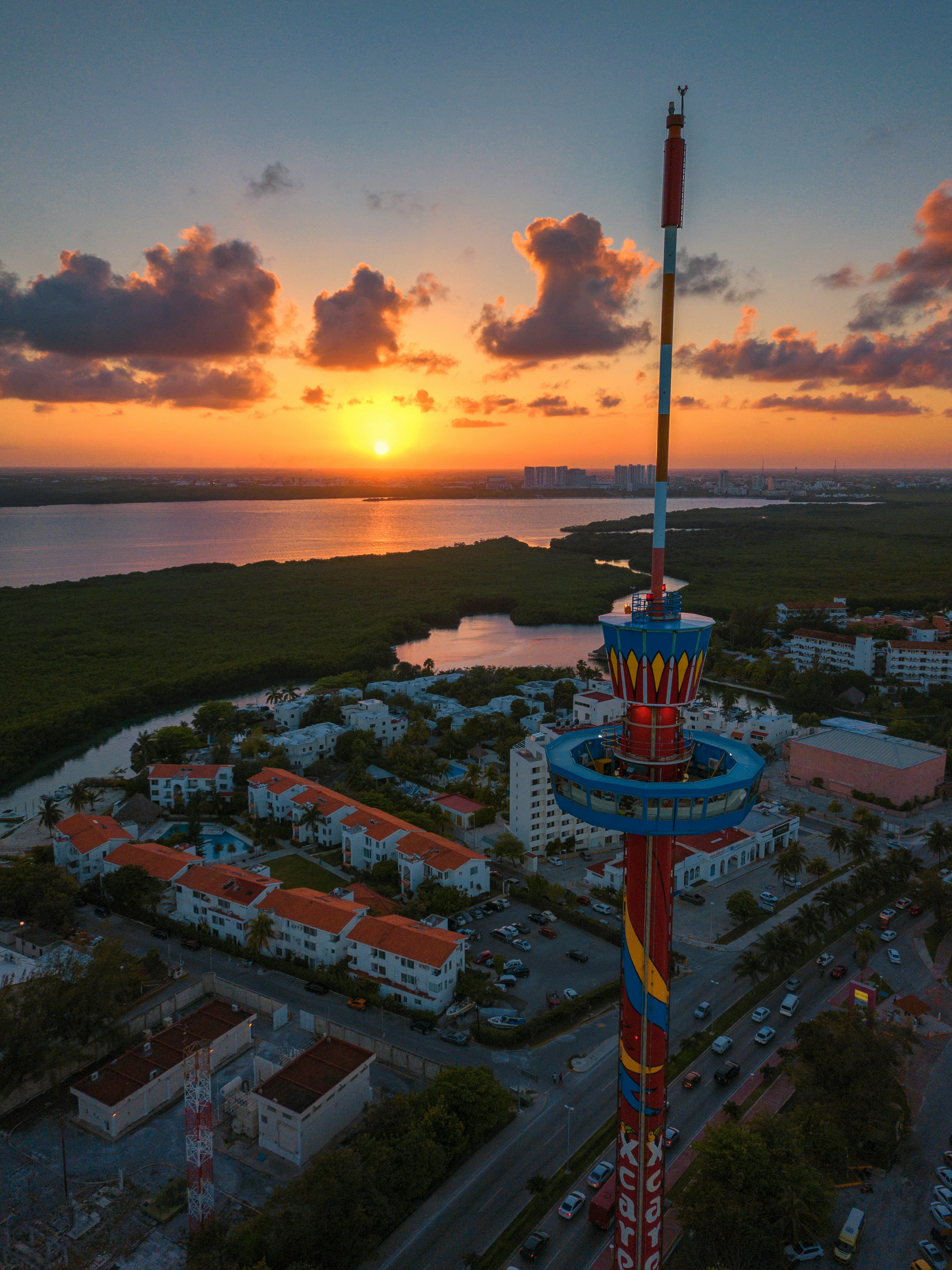 red and blue metal tower during golden hour