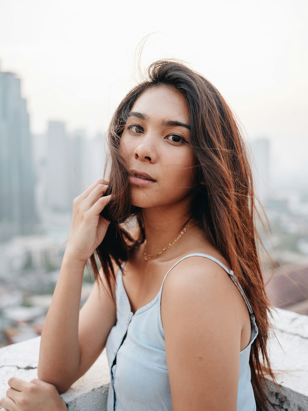 woman wearing teal blouse