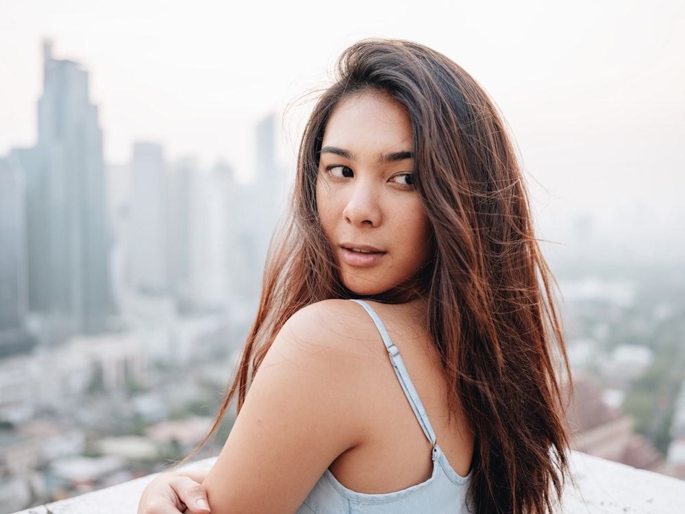 woman wearing white tank top