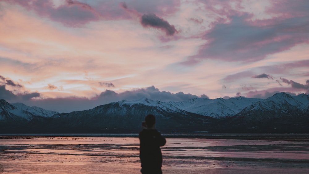 person fronting mountain