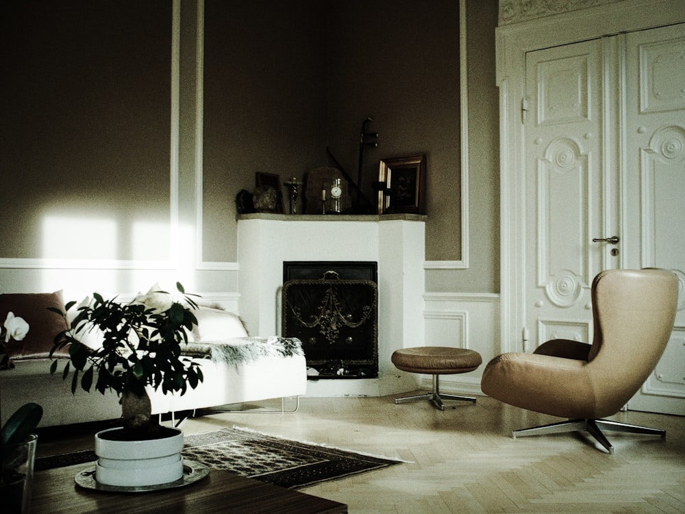 brown rolling chair in front of fireplace