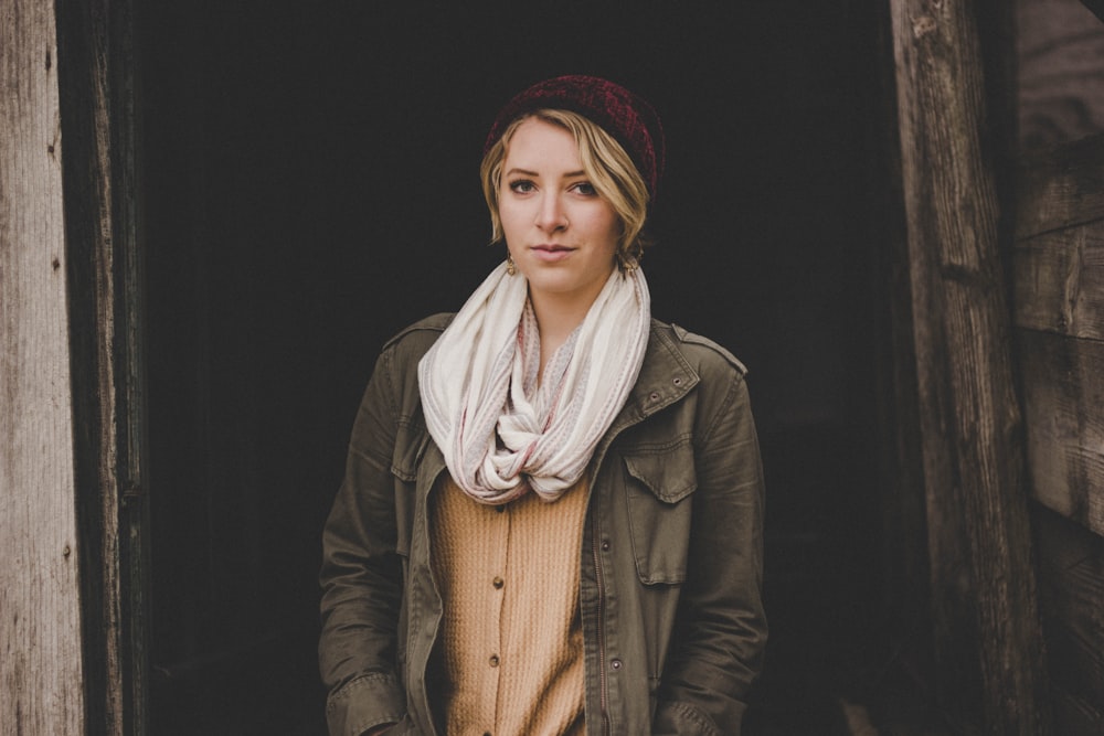 woman wearing scarf, jacket, and button-up shirt