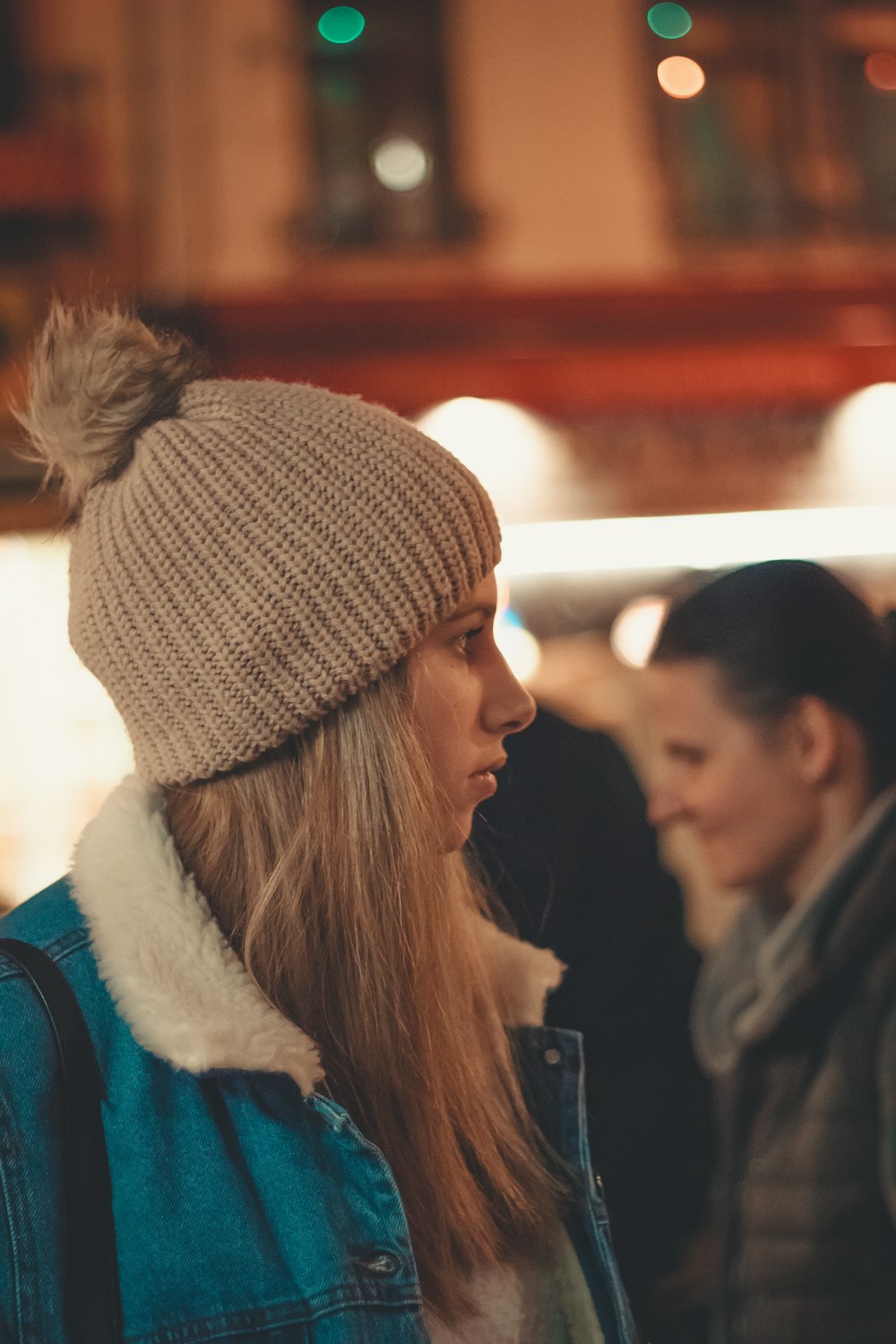 woman wearing brown knit top