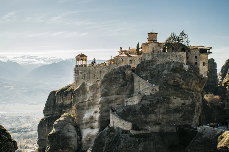 A monastery built on top of a sheer rock pillar