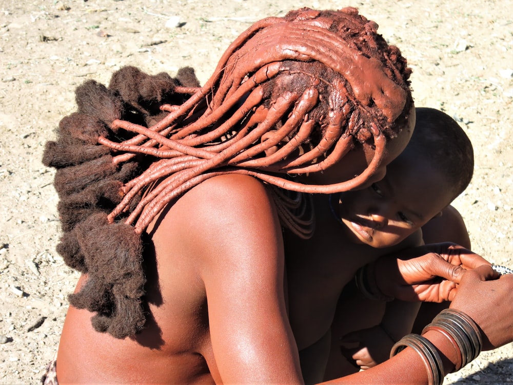 woman carrying baby