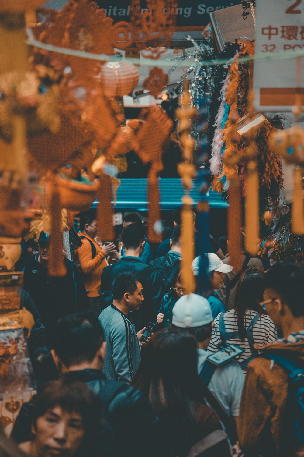 selective focus photography of people along night market