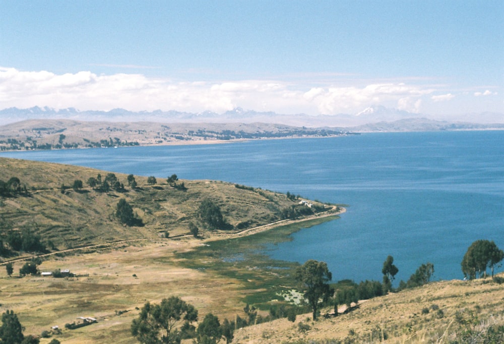 plains across body of water and clouds