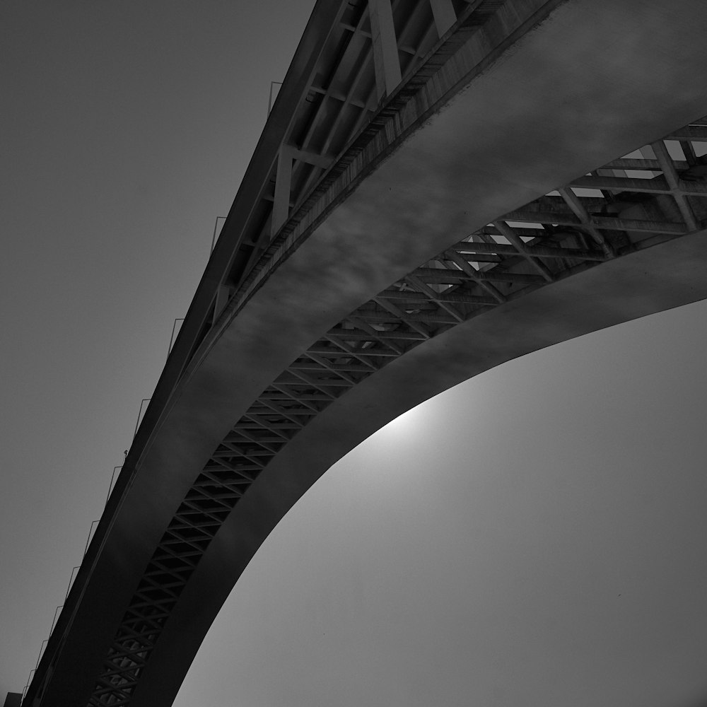 a black and white photo of a bridge