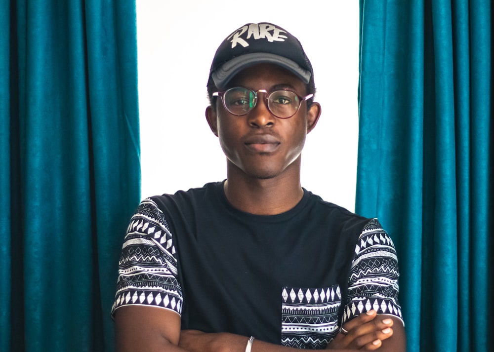 man wearing black Rare-printed cap