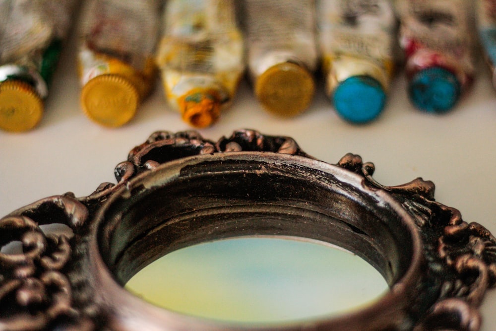 round black framed mirror close-up photography