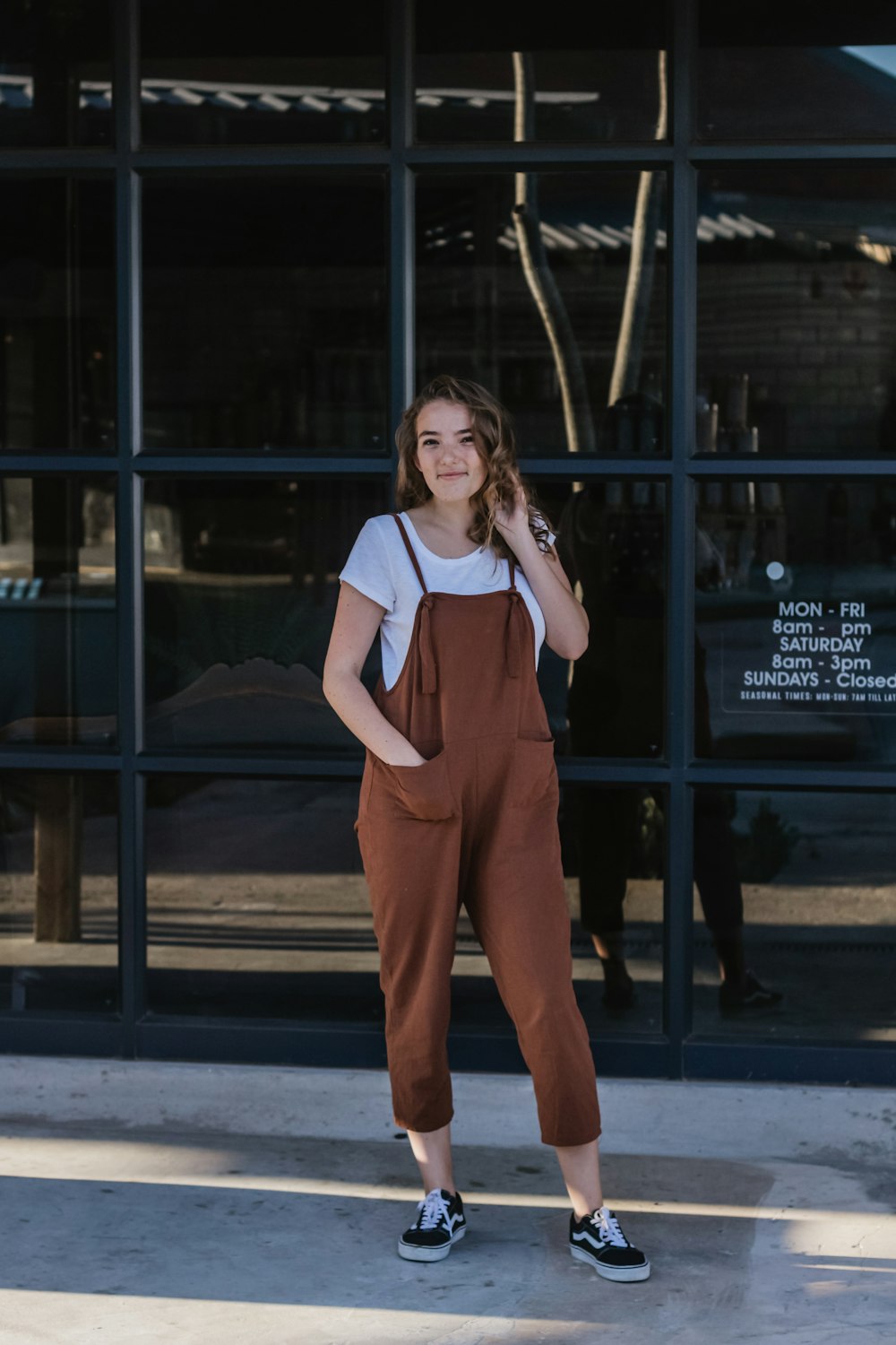 woman wearing brown overall pants