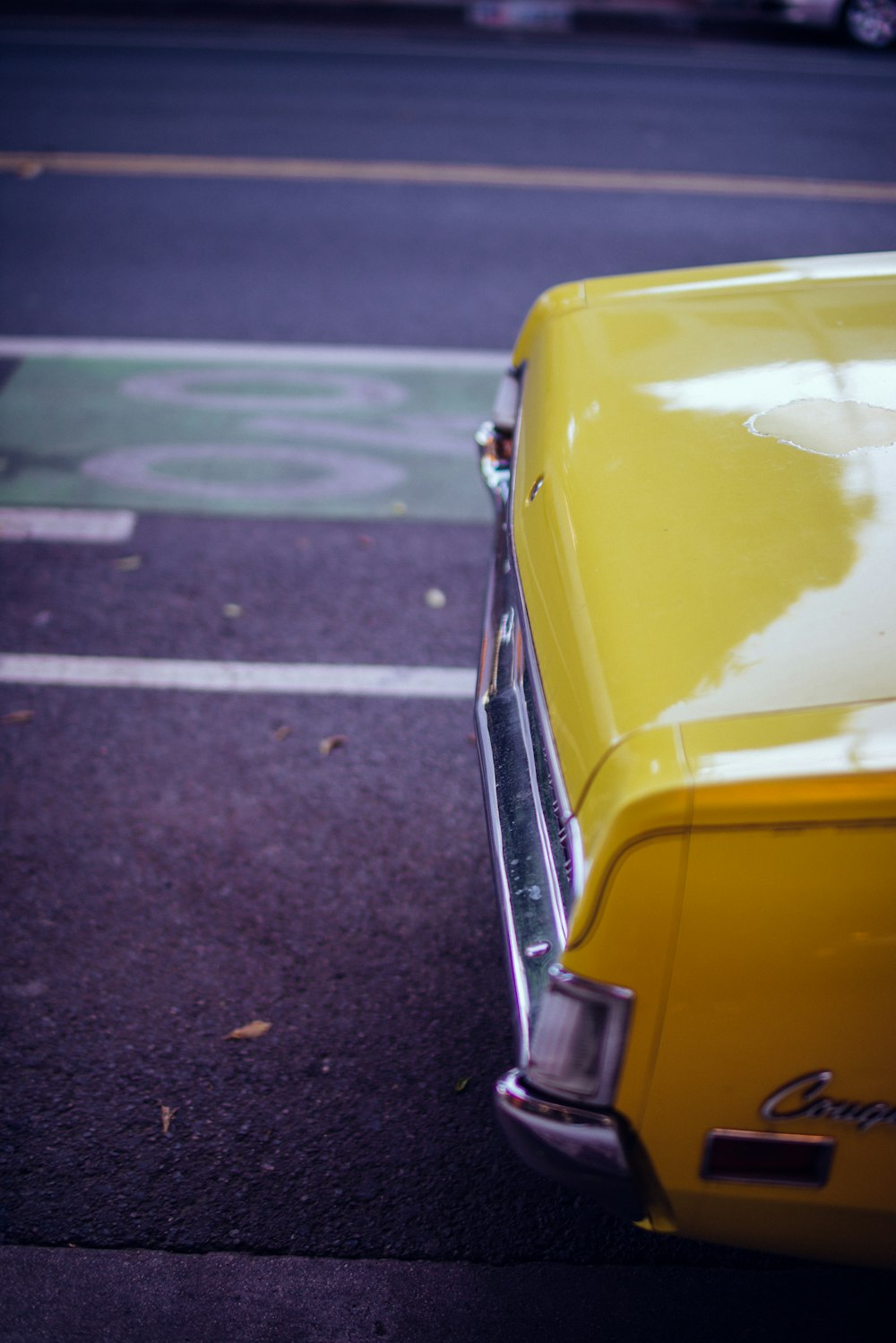 yellow car on road