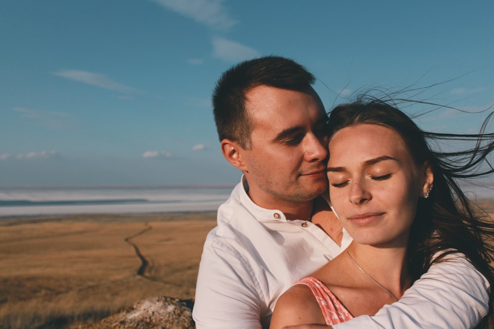 man and woman taking selfie during daytime