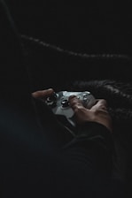person holding white game controller