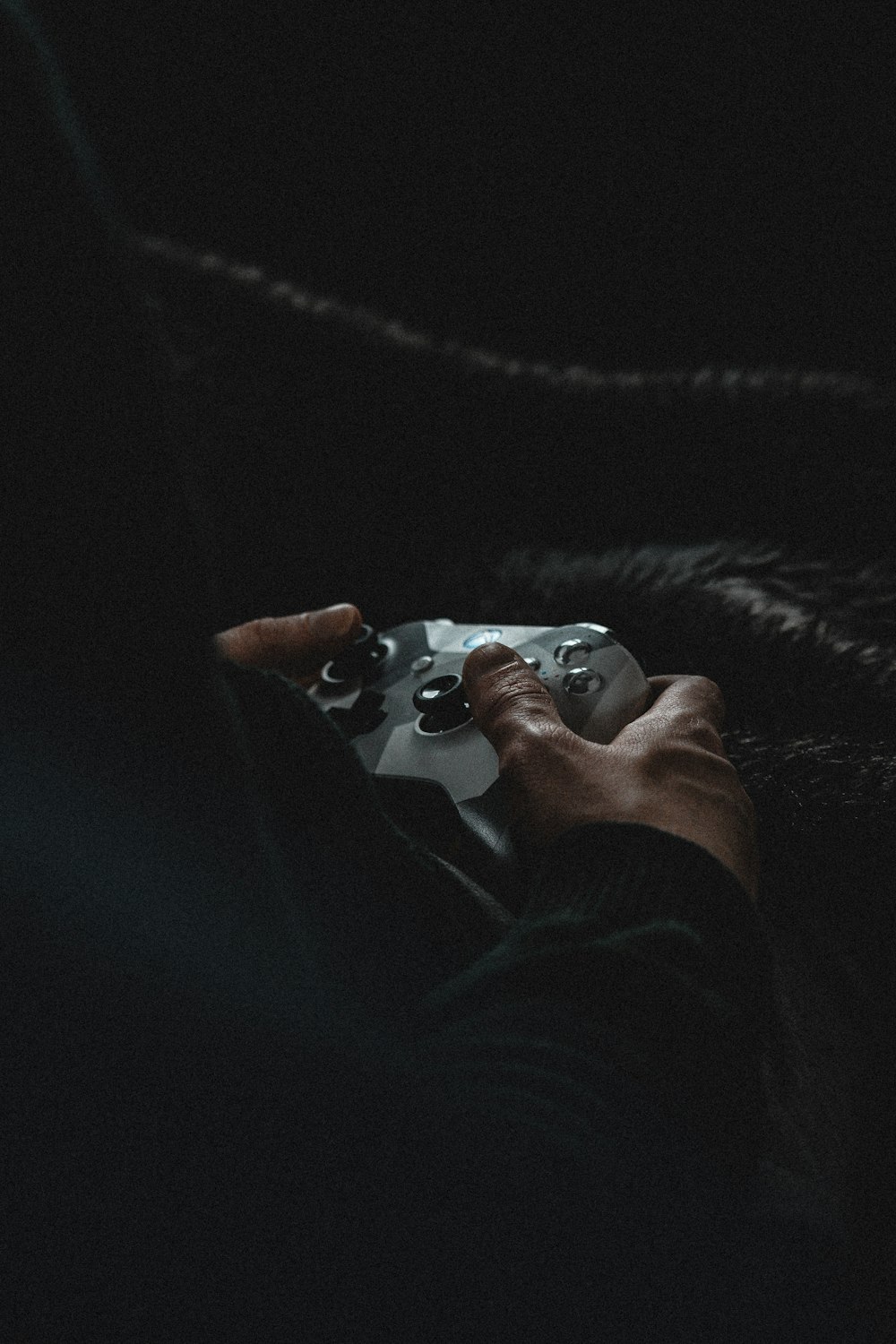 person holding white game controller