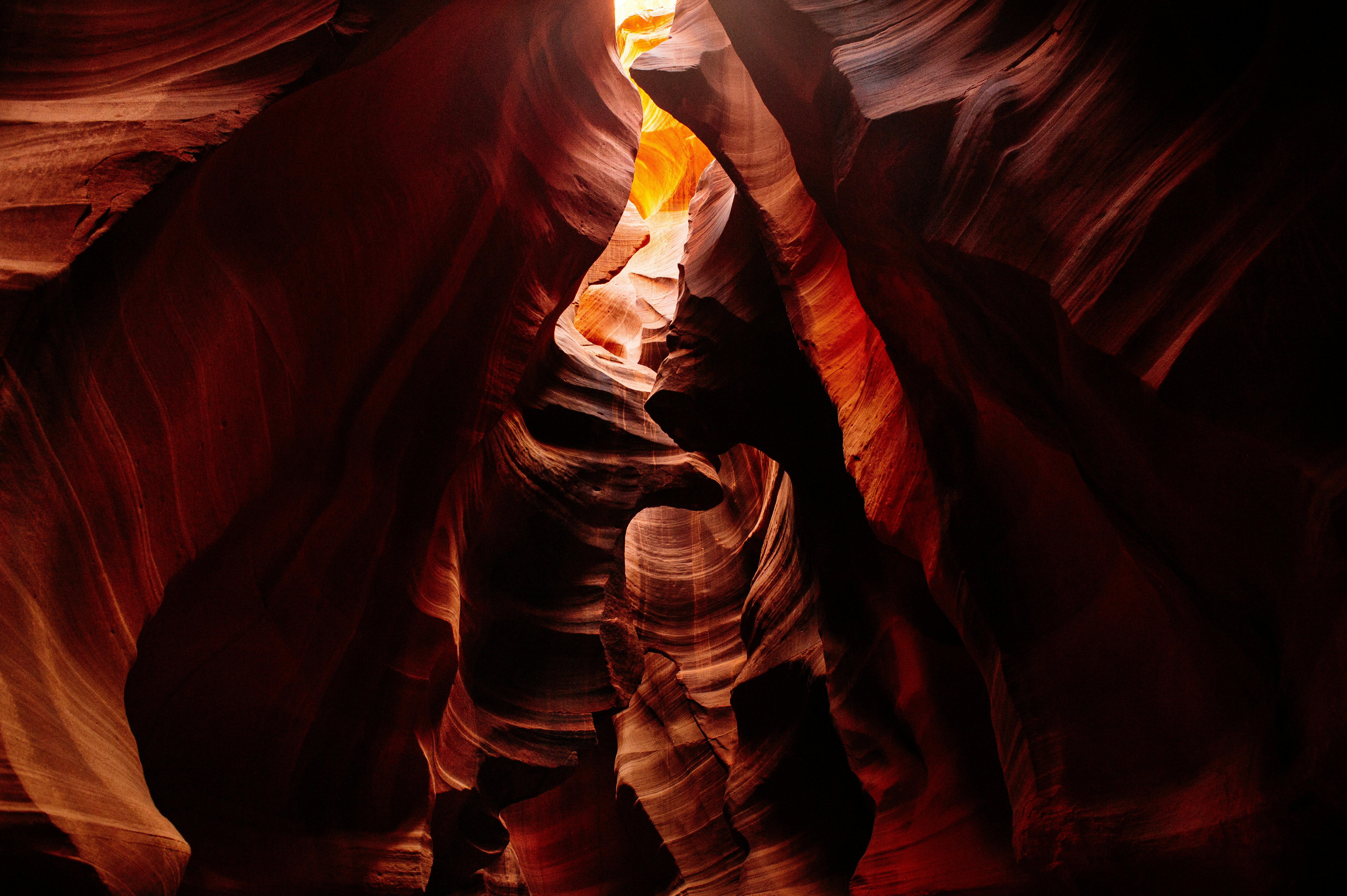 It has been photographed a billion times, but I always find something that interests me. This trip was no different. I tried shooting up into the crevasse above to capture the subtle ways light would play down the edges and smooth sides of the polished sandstone.