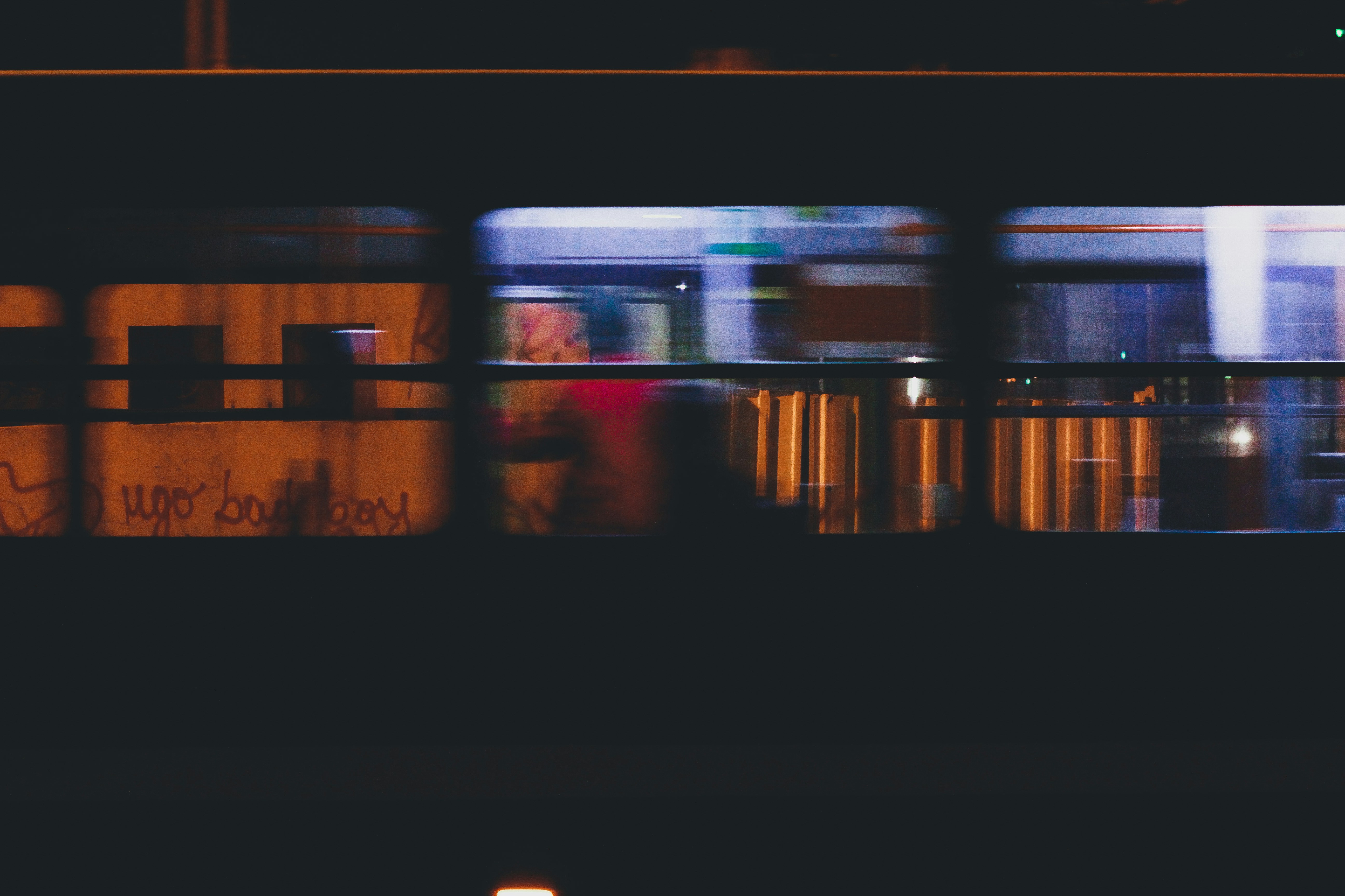 a blurry photo of a train at night