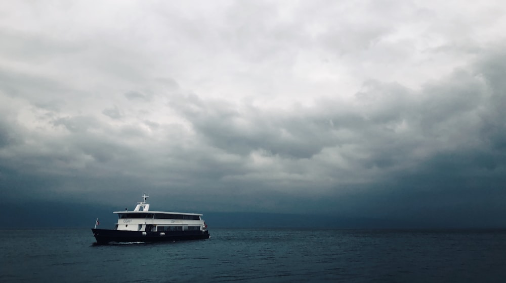 white and black ship on sea