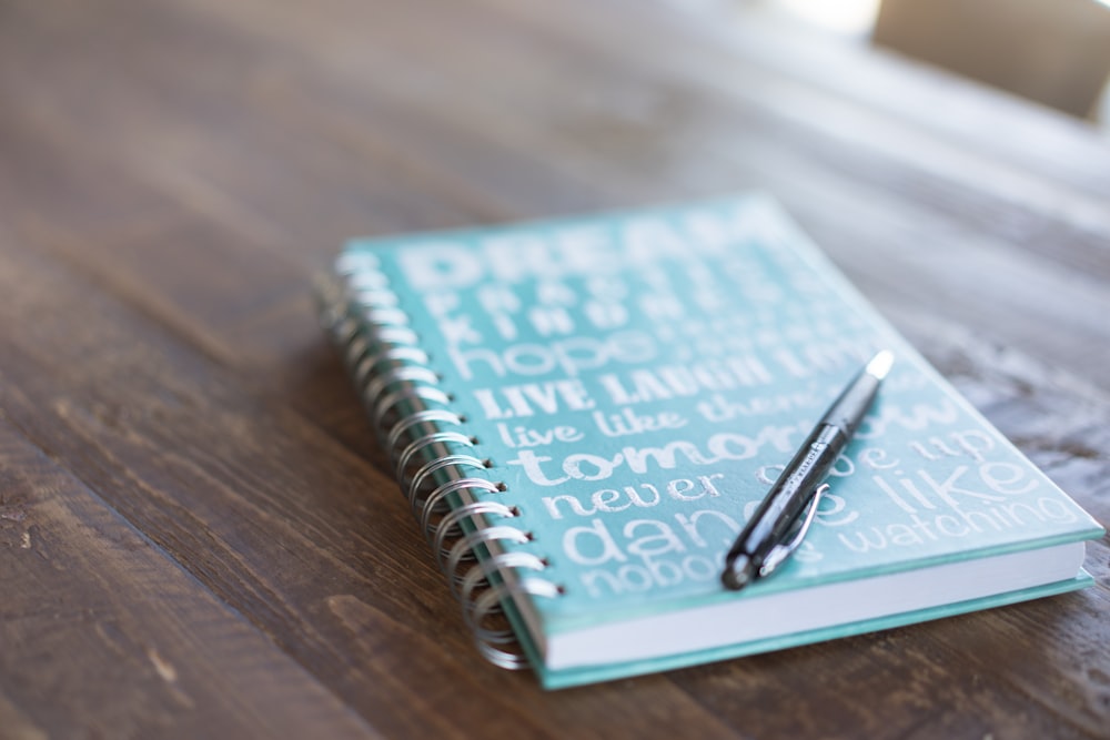 pen on book in table