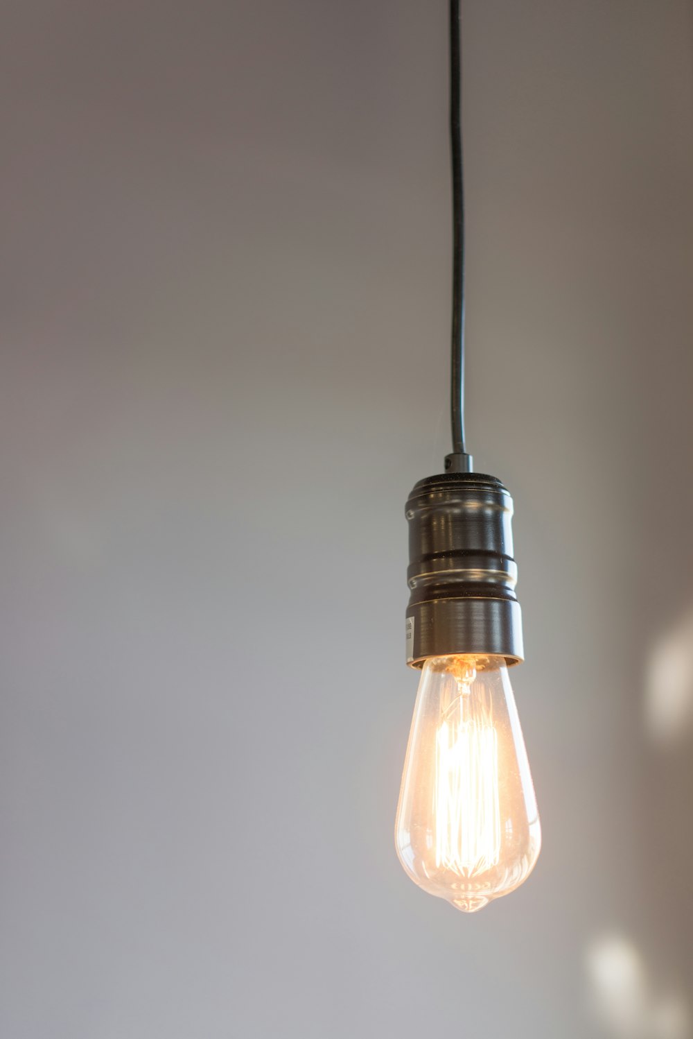 turned on gray pendant lamp