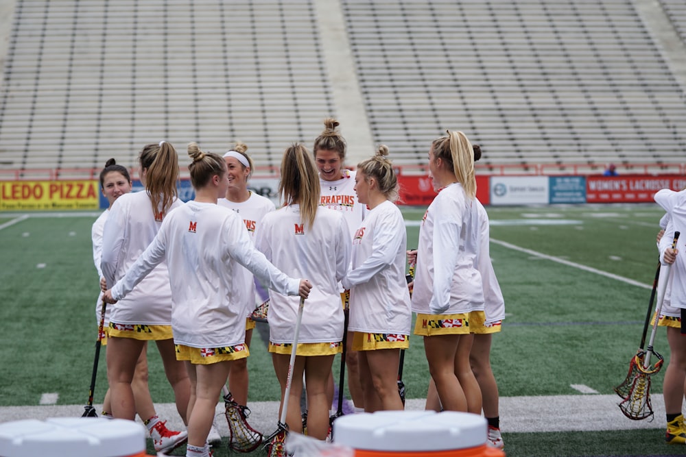 group of women playing lacrosse