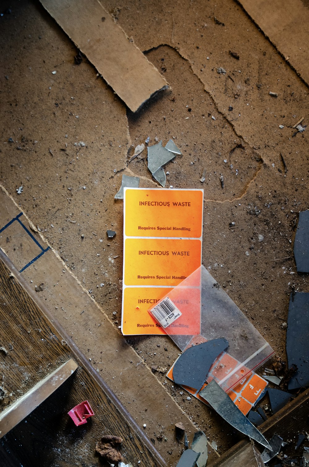 orange card on broken wooden surface