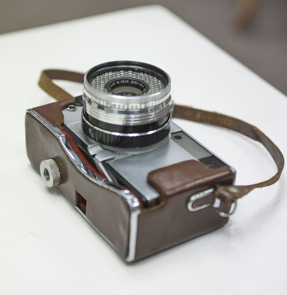 brown and gray mirrorless camera