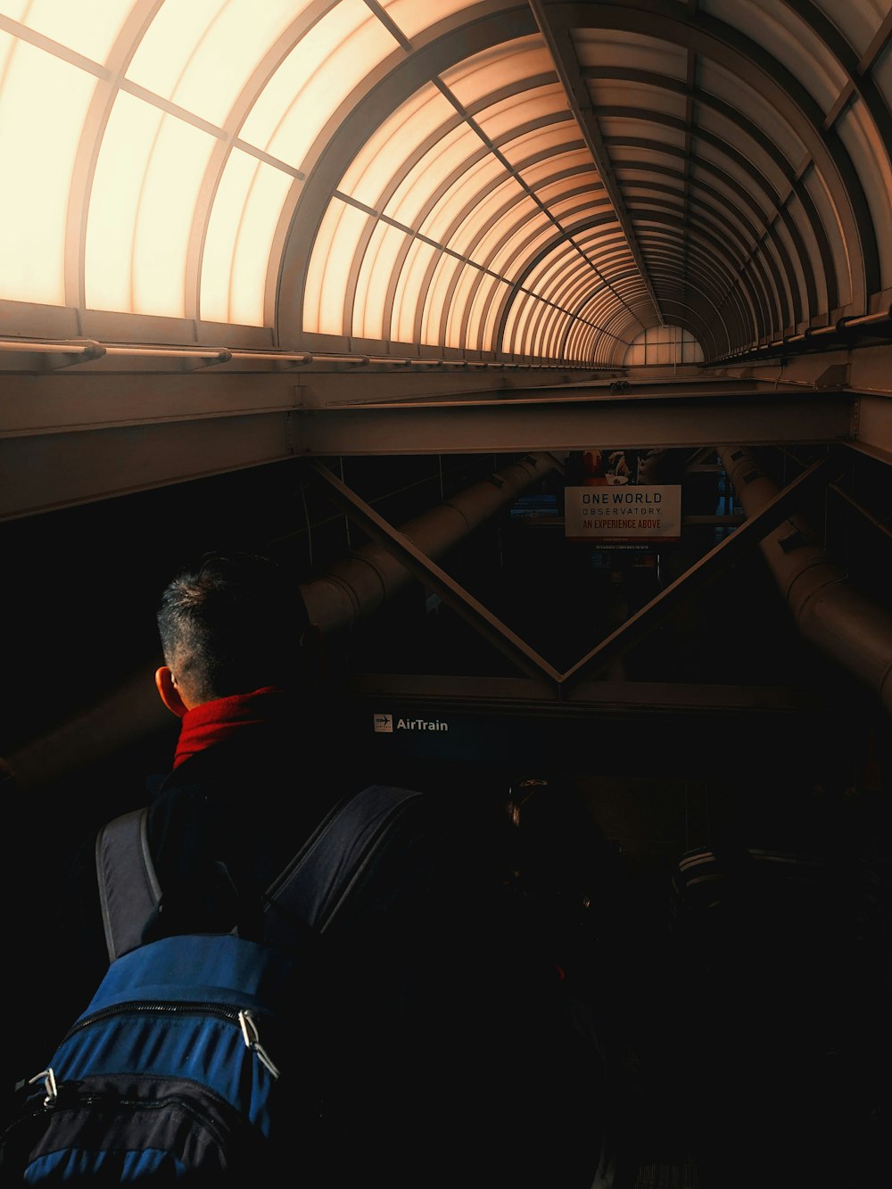 man with backpack in subway