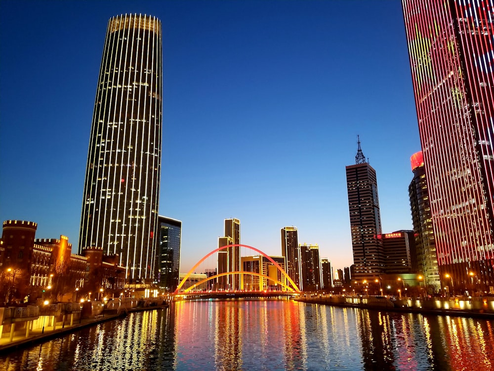 lighted city skyline at dusk