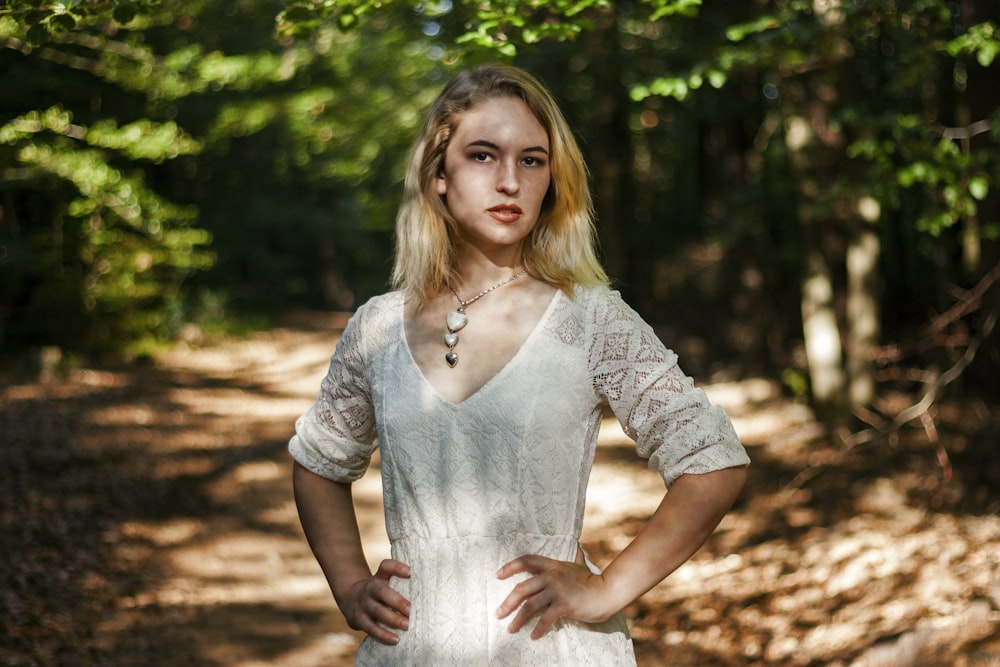 woman standing near trees at daytime