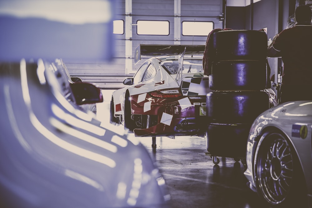 vehicle tires beside red car