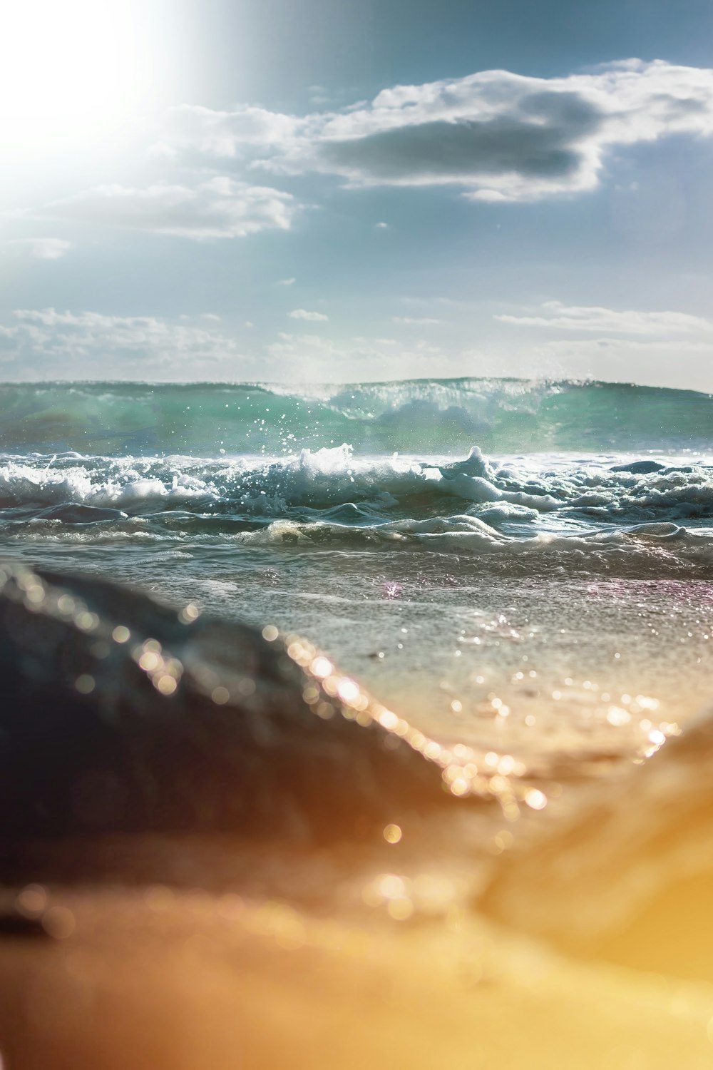 waves breaking in beach at dusk