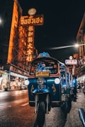blue auto rickshaw on road