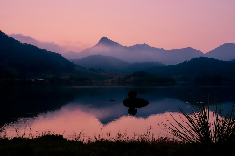 fogs rising from surface of lake