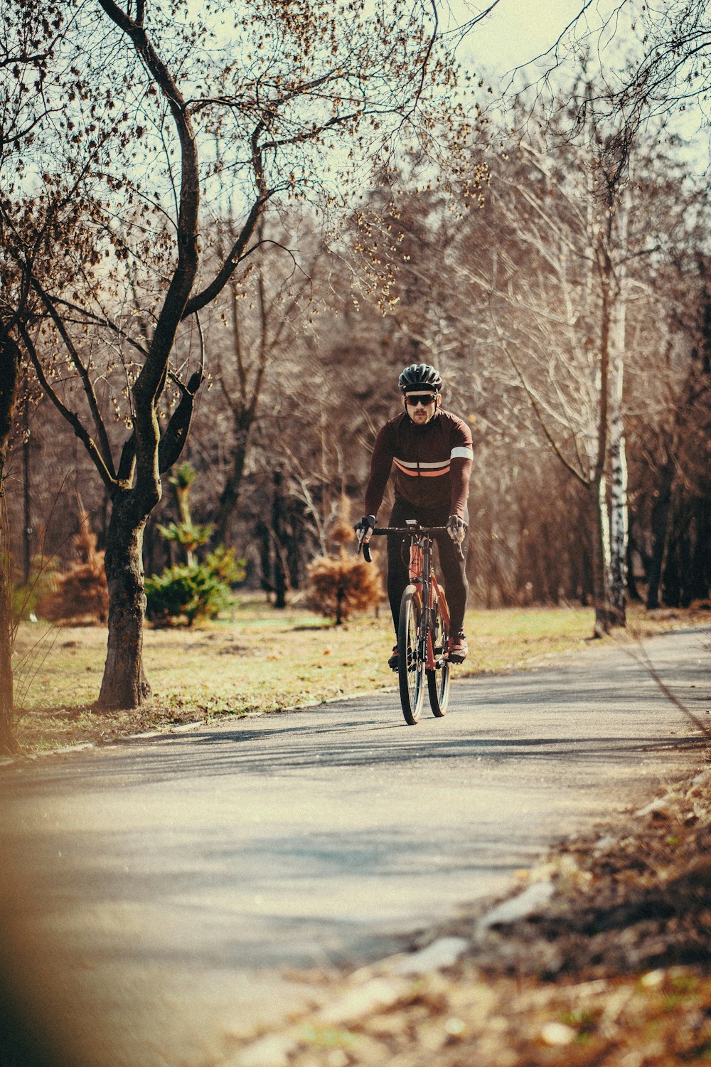 man in black shirt ridding a bicycle