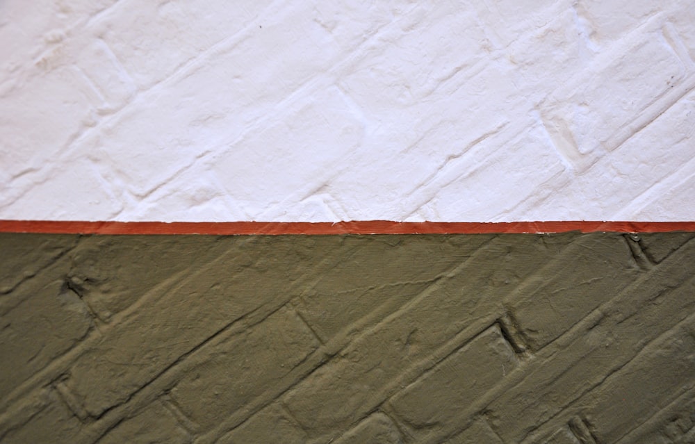 a close up of a white and orange wall