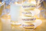 Artisan Peruvian alfajores stacked neatly with powdered sugar dusting.