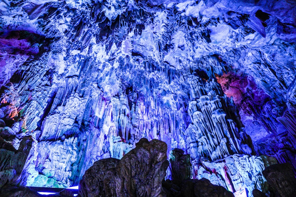 a large cave filled with lots of blue and purple rocks