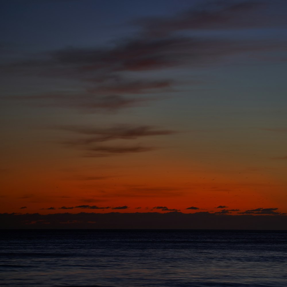 calm water during sunset