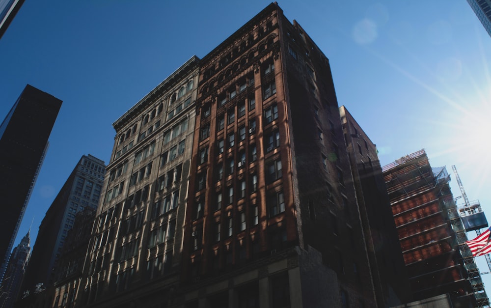 low-angle photography of brown concrete building