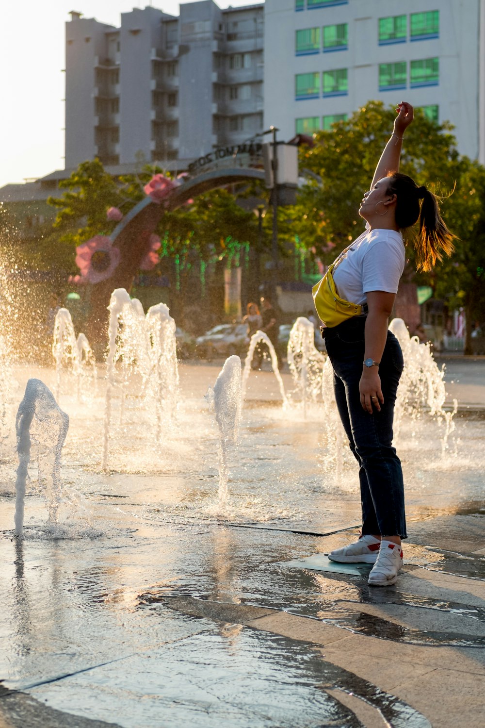 woman standing near water fountain