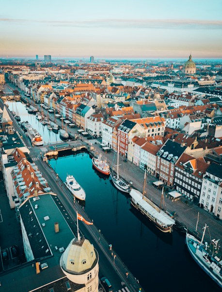 Aerial view of Nyhavn in Copenhagen with its coloured townhouses and moored boats