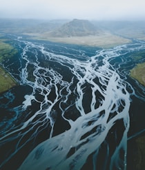 mountain surrounded with body of water